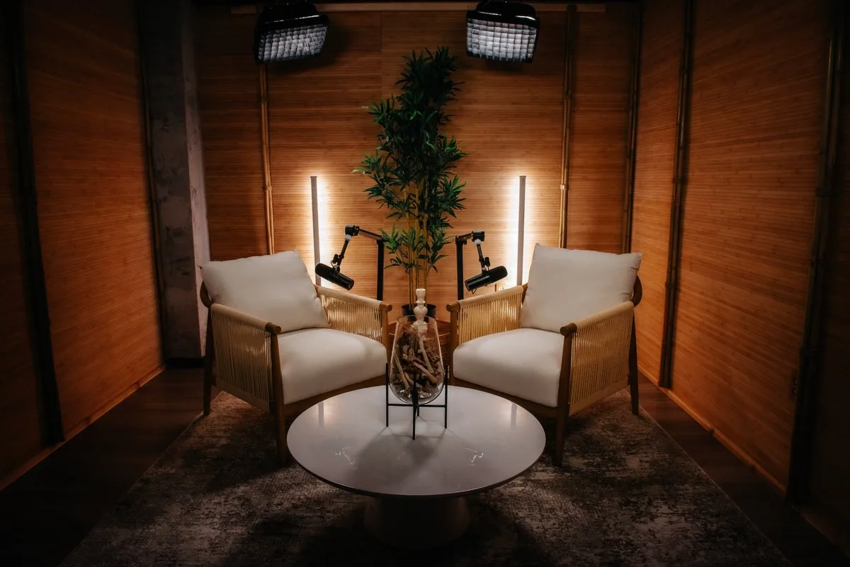 Serenity studio with soft lighting, natural textures and two lounge chairs